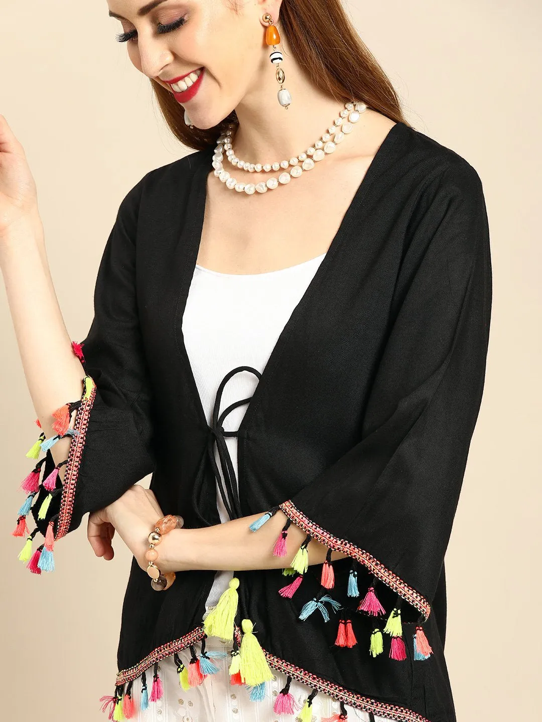 Women Solid Black Shrug With Tassle And Pom Pom Detail